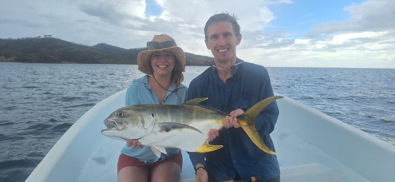 Happy couple with jack crevalle